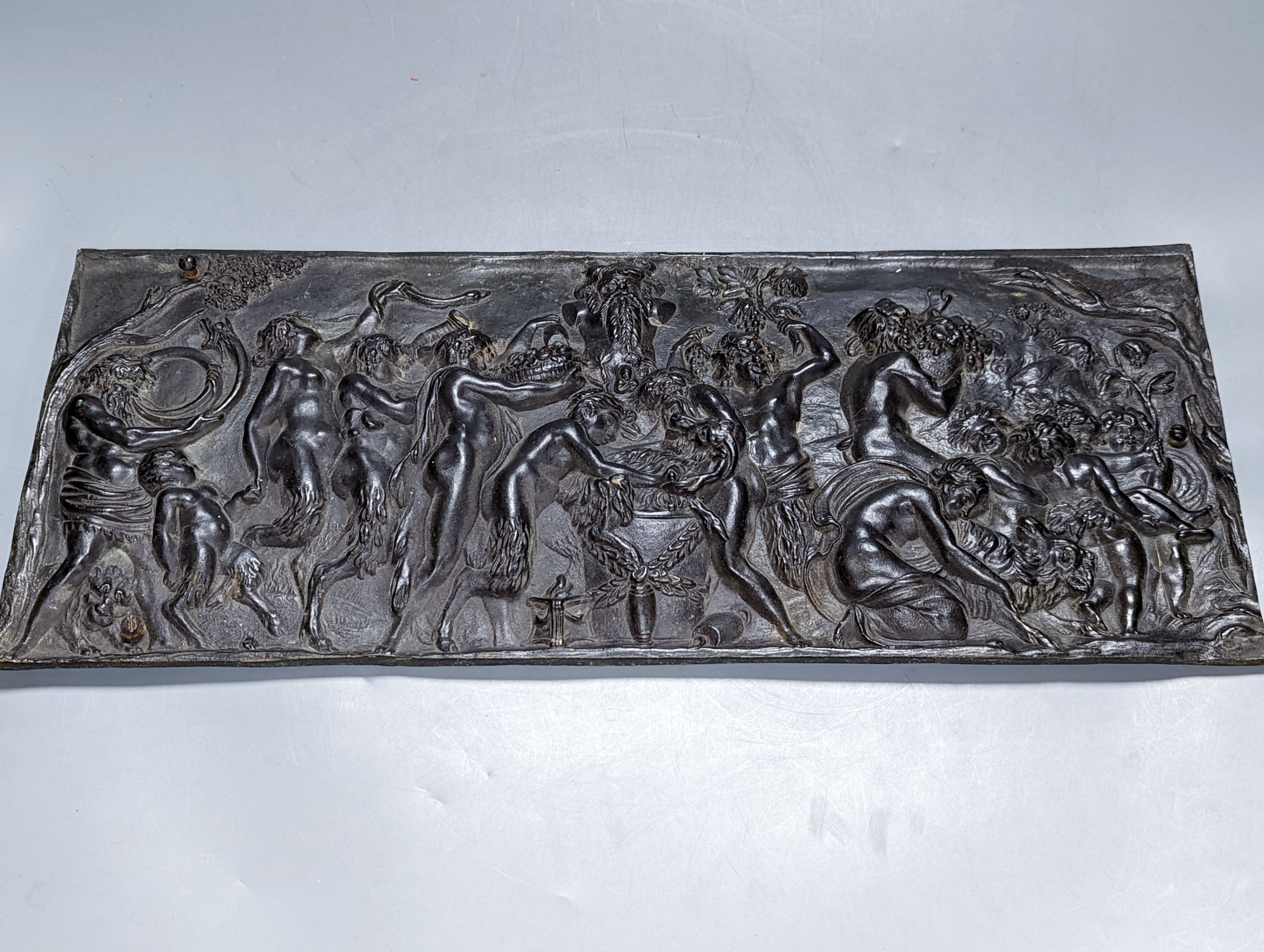 A 19th century cast bronze Bacchanalian plaque, 47 cms wide x20 high.